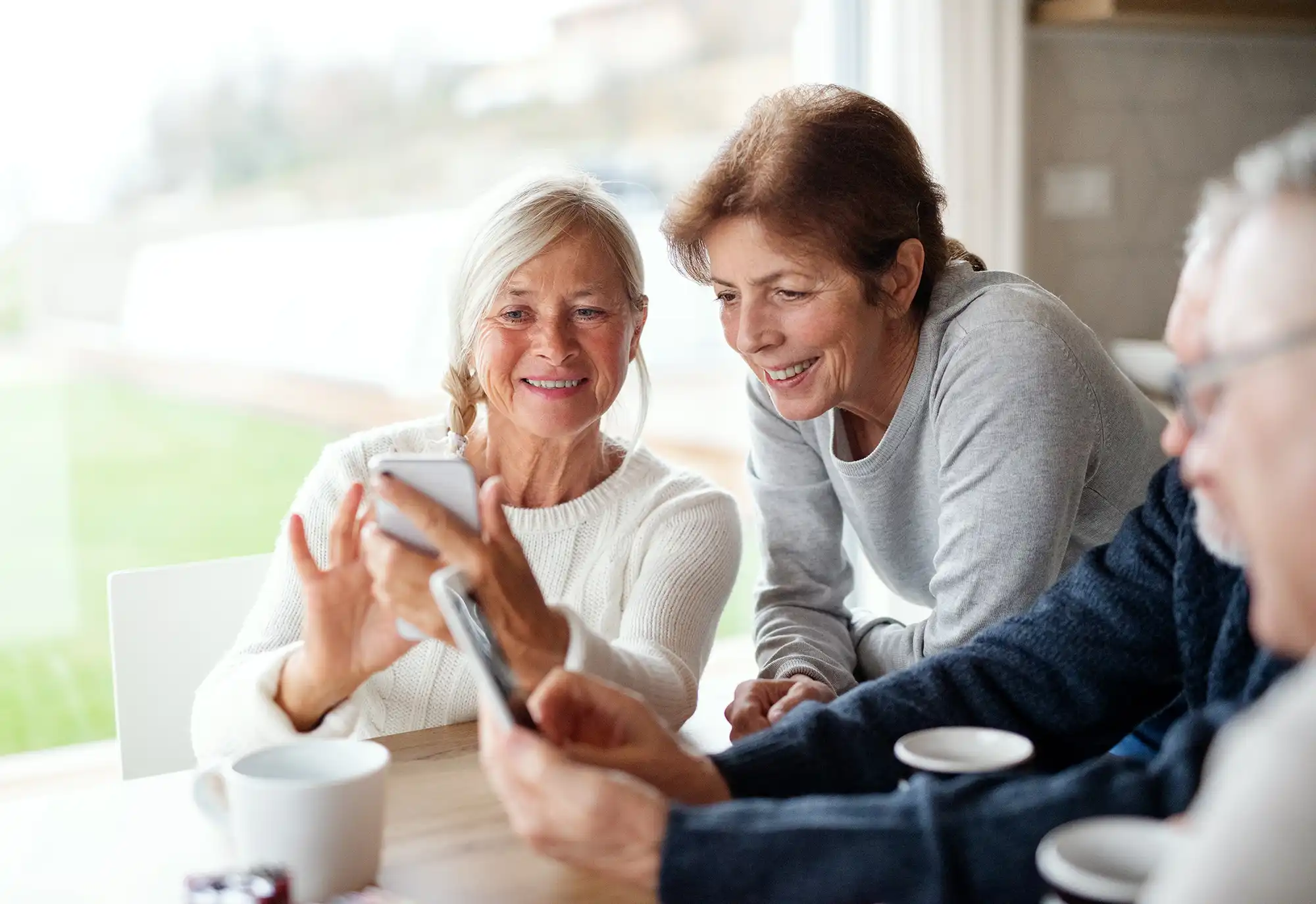 Friends looking at a cell phone